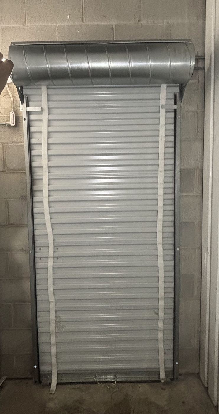Roll-up door with springs in the barrel