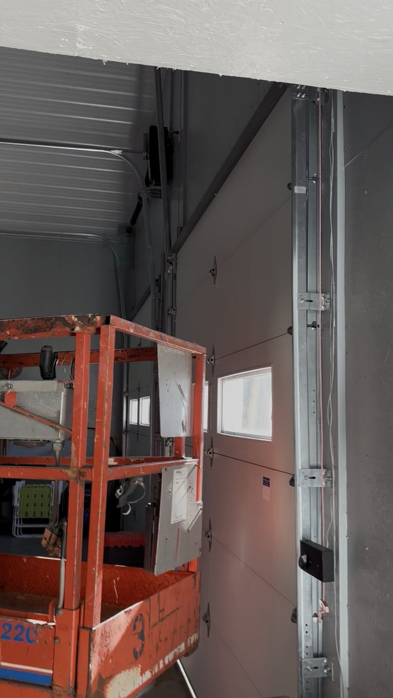 Jackshaft opener on a sectional door