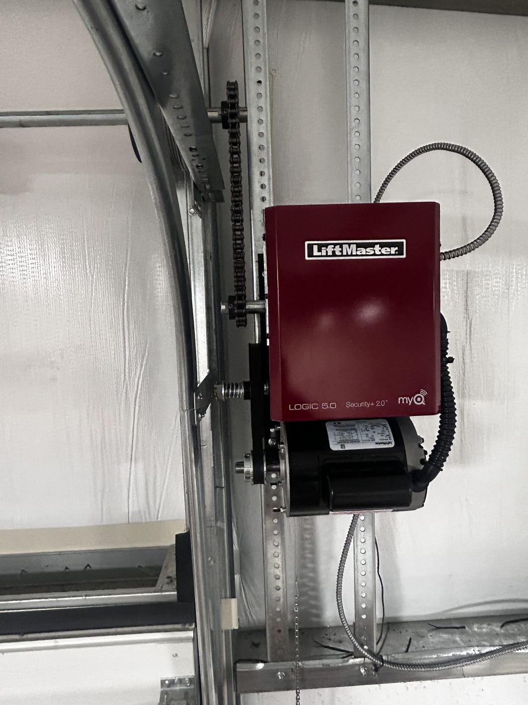 LiftMaster jackshaft opener installed beside a commercial door
