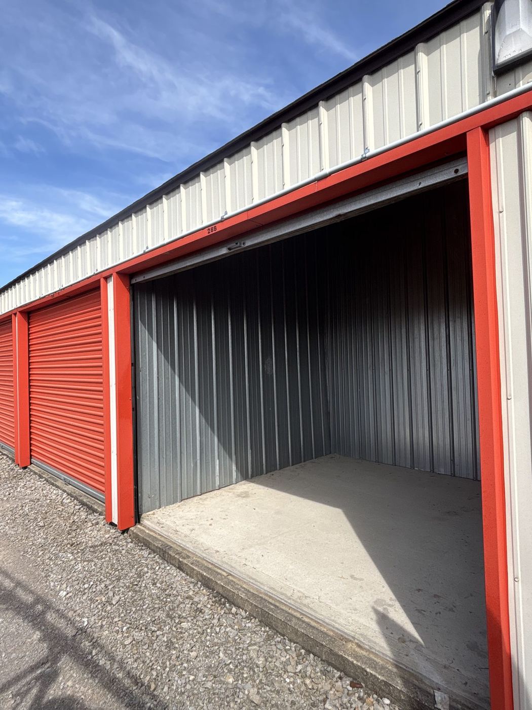 Self-storage unit with a roll-up door